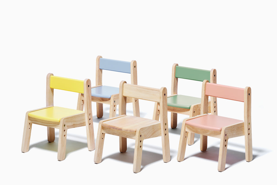 The Yamatoya Norsta3 Kids Chair shown in all five colours: Natural, Forest Green, Coral Pink, Rain Blue, and Moon Yellow.